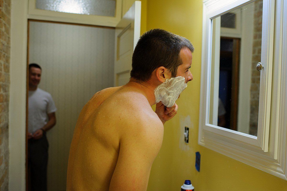 groom shaving before the ceremony