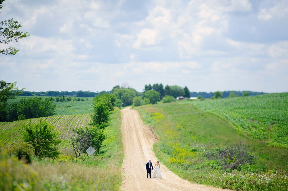 Bride and groom holding hands 